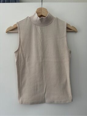 Cream sleeveless mock neck sweater